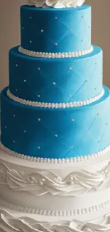 Three-tiered blue and white wedding cake with elegant frosting design.