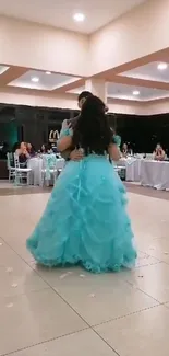 Elegant ballroom dance with a blue dress.