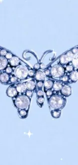 Elegant blue butterfly jewelry on soft light blue background.