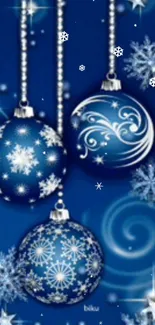 Blue Christmas ornaments with snowflake designs.