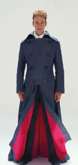 Elegant man in a blue coat with red accents on a minimalist background.