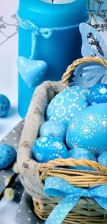 Blue Easter basket wallpaper with decorated eggs and candle.