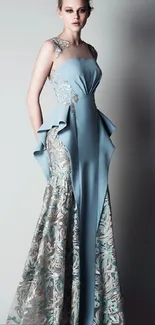 Elegant woman in a stunning blue evening gown with lace designs.