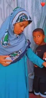 Mother and child in elegant blue attire, a heartwarming family scene.