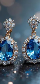 Elegant blue gemstone earrings with diamonds on display.