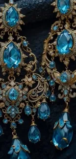 Elegant blue gemstone earrings with intricate gold designs.