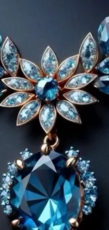 Elegant blue gemstone necklace with intricate design on dark background.