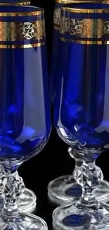 Elegant blue glasses with gold accents.