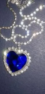 Elegant necklace with blue heart pendant mobile wallpaper.