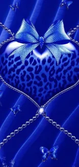 Blue heart wallpaper with ribbon and intricate details.