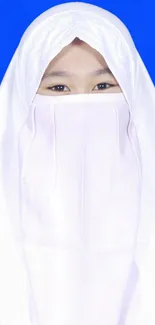 Person in white hijab on blue background wallpaper