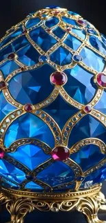 Ornately designed blue jewel egg with gold and red accents.