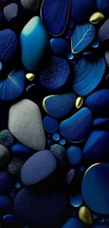 Elegant blue pebbles with golden accents on dark background.