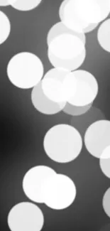 Elegant black and white bokeh wallpaper with soft circles.