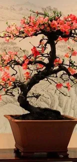 Bonsai tree with pink blossoms in a tranquil setting.