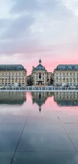 Bordeaux's Place de la Bourse at sunset with water reflection.