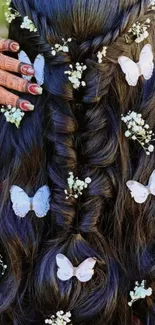 Intricate braid with white butterflies in dark hair.