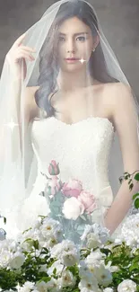 Elegant bride in white dress with floral bouquet and veil.