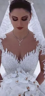 Bride in elegant lace gown with white orchid bouquet.