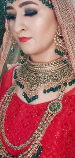 Elegant bride with jewelry and red attire, showcasing cultural beauty.