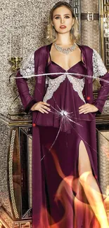 Model in burgundy evening gown with elegant design.