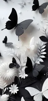 Intricate black and white butterfly wallpaper with floral elements.