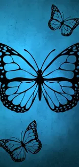 Blue butterfly wallpaper with elegant black silhouettes.