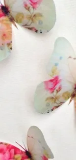 Delicate butterflies with floral patterns on a soft pastel background.