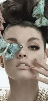 Woman with butterfly adorned hairstyle and pearl accessories.