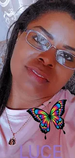 Elegant woman with butterfly on shirt.