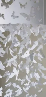 White paper butterflies dangling elegantly in a minimalist design.