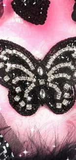 Black jeweled butterfly on vibrant pink background