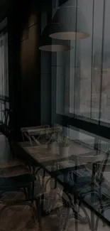 Dimly lit cafe interior with wooden furniture and large windows.