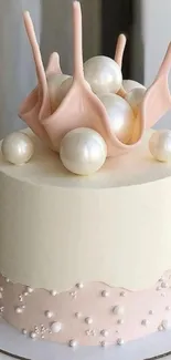 Elegant cake with pink décor and pearls.