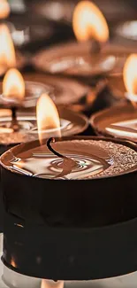 Elegant candles flickering warmly in a serene setting.