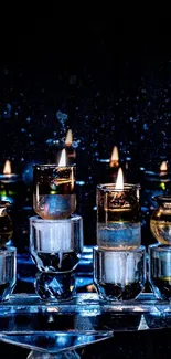 Candlelight arrangement with glowing flames in glass holders against a dark background.