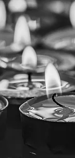 Black and white candlelight wallpaper for phones, featuring serene flickering flames.