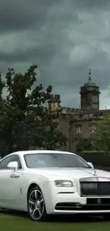 Luxury white car parked near a historic castle under cloudy skies.