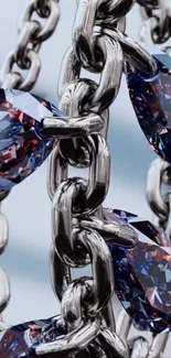 Silver chain with blue gemstones on a mobile wallpaper.