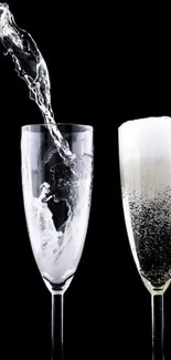 Elegant champagne glasses with black background.