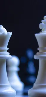 Elegant white chess pieces on a board with dark blue background.