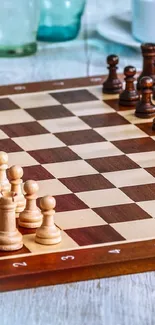 Chessboard with elegant wooden pieces on a classic board setup.