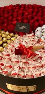 Chocolate assortment with red roses in elegant gift box.