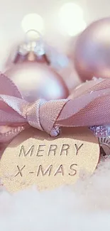 Soft pink Christmas baubles and ribbon with Merry X-Mas tag.