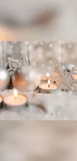 Elegant Christmas setting with candles and silver ornaments.