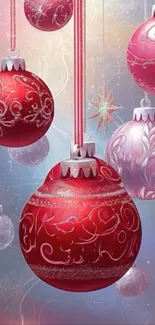 Elegant Christmas ornaments in red, pink, and silver designs.