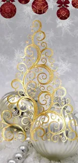 Elegant gold swirl Christmas ornaments in a snowy setting.