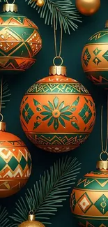 Elegant Christmas ornaments on green background with pine branches.