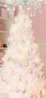 Elegant white Christmas tree with pastel ornaments and chandelier.