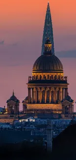 Sunset cityscape with illuminated architecture tower.